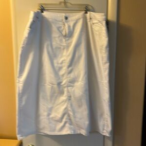 CJ Banks white denim skirt with dazzled back pockets.  31” long slit in back